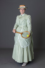 A Victorian Woman Wearing A Tennis Ensemble