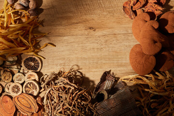 Traditional chinese medicine with herb and spices in brown wooden background and blankspace for medicine advertising , photography traditional medicine content