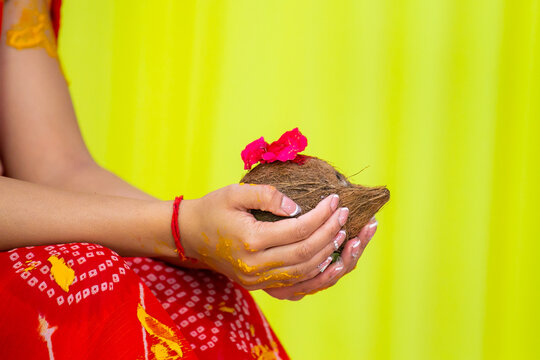 Indian Hindu pre wedding Haldi ceremony ritual items, turmeric, hands close up
