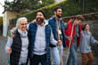 © Halfpoint - Diverse group of happy volunteers walking with tools to do street clean up, community service concept