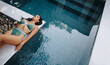 © Jacob Lund - Unwinding by the poolside