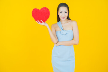 Poster - Portrait beautiful young asian woman smile with heart pillow shape