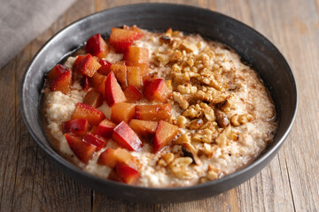 Wall Mural - Porridge with plums walnuts and cinnamon