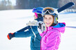 © Kalim - Young couple having fun while winter skiing