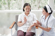 © u photostock - Female nurses take care of senior woman at home