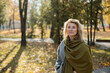 © Westend61 - Beautiful woman wearing shawl in autumn park