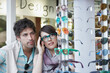 © Westend61 - Woman trying on eyeglasses by boyfriend in store