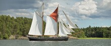 An Elegant Two-masted Gaff Schooner (training Tall Ship) Sailing In Mälaren Lake, Sweden. Travel, History, Traditions, Transportation, Sailing, Sport, Cruise, Regatta, Teamwork. Panoramic View
