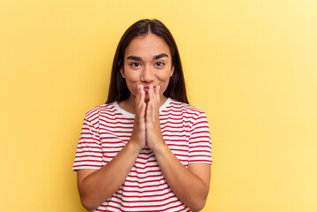 Wall Mural - Young mixed race woman isolated on yellow background making up plan in mind, setting up an idea.