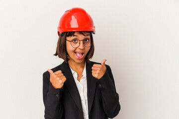 Wall Mural - Young architect woman with red helmet isolated on white background raising both thumbs up, smiling and confident.