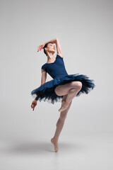 Wall Mural - Beautiful ballerina posing in studio.