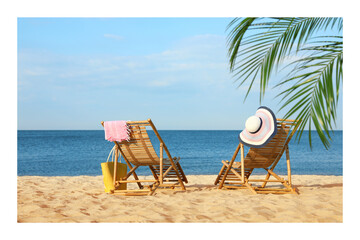 Wall Mural - Paper photo. Wooden sunbeds and beach accessories on sandy shore