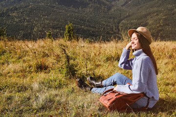 Canvas Print - Young woman enjoying beautiful mountain landscape on sunny day