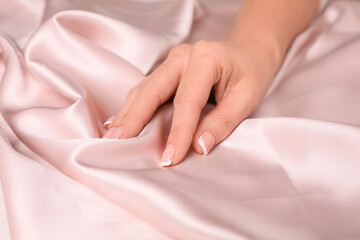 woman touching smooth silky fabric, closeup view