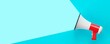 © Shawn Hempel - White and red megaphone or bullhorn over cyan blue background, business announcement or communication concept, flat lay top view from above with copy space
