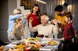 © BGStock72 - Family celebrating grandfather birthday with cake and candles at home