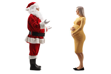 Wall Mural - Full length profile shot of santa claus talking to a pregnant woman