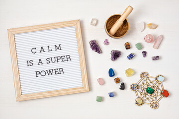 Letter board with motivation text calm is a super power. Gemstones, crystals for megitation and relax. Natural elements for cleansing negative energy, adding positive vibes. Mental health and balance 