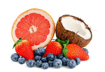 Heap of different fresh berries and fruits isolated on white background.