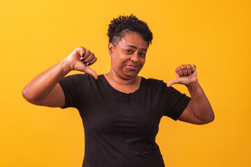 Mature afro woman with thumb down