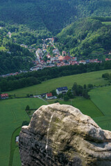 Wall Mural - View from Lilienstein Mountain at town of Koenigstein with rock in foreground, Saxon Switzerland, Germany.