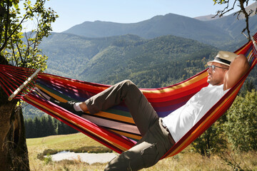 Sticker - Man resting in hammock outdoors on sunny day