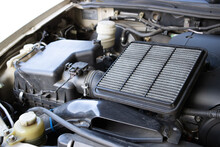 Manual Car Air Filter Replacement To Maintain Engine Performance.Air Filter Is Clogged. Causing Incomplete Combustion In The Engine Compartment