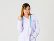 © Bangkok Click Studio - Portrait studio shot of Asian young successful professional confident dyed hair female doctor in lab coat hanging stethoscope around neck look at camera on white background