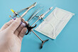 Dentistry medical tools syring on blue background.