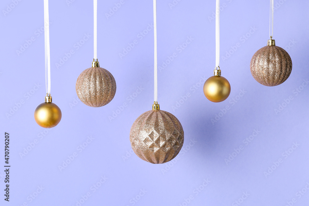 Beautiful Christmas balls on lilac background