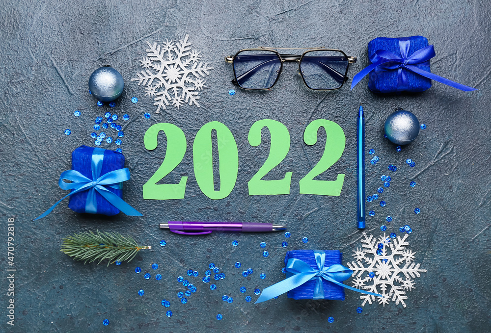 Figure 2022 with office supplies and decor on dark background