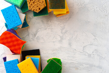 Wall Mural - Pile of colorful cleaning sponges on gray background