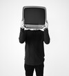 © Rawpixel.com - Man standing and holding a TV