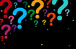 Black background with rainbow question mark. Random large and small question mark.