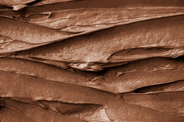 Wall Mural - Chocolate frosting texture background close-up