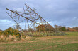 Fallen electricity pylon in a field