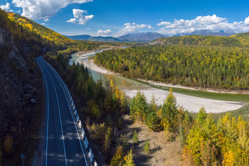 Wall Mural - Aerial view of the Irkut River and the road in the Eastern Sayan Mountains