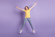 © Tetiana - Full body photo of young cheerful girl have fun jumper fly active isolated over purple color background