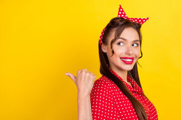 Canvas Print - Photo portrait woman smiling in dotted outfit showing thumb copyspace isolated bright yellow color background