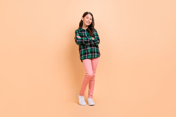 Canvas Print - Photo of funky cool schoolgirl wear plaid outfit dancing arms crossed smiling isolated beige color background