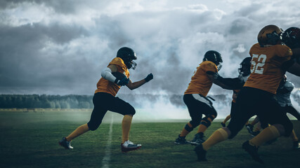 Wall Mural - American Football Field Two Teams Play: Successful Player Running Around Defense Players to Score Touchdown Points. Professional Athletes Compete for the Ball, Fight for Victory.