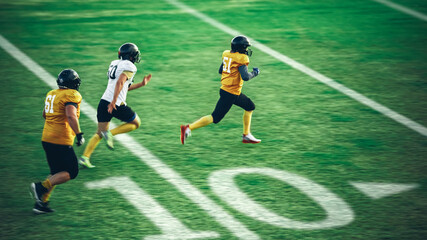 Wall Mural - American Football Teams Start Game: Professional Players, Aggressive Face-off, Tackle, Pass, Fight for Ball and Score. Warrior Competition Full of Brutal Energy, Power, Skill.