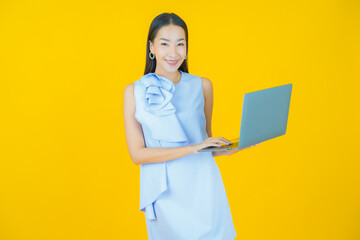 Wall Mural - Portrait beautiful young asian woman smile with computer laptop