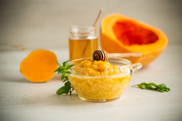 Wall Mural - sweet boiled pumpkin porridge in a bowl with honey