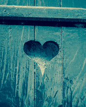 Old Wooden Blue House Shutter With Carved Heart Shape. Moody Valentines Day Background. 