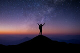 Fototapeta Kosmos - Young traveler with backpack standing and open both arm and watched night sky view, star and milky way alone on top of the mountain. He enjoyed traveling and was successful when he reached the summit.