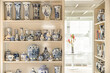 © ADDICTIVE STOCK - Gzhel styled vases on shelves