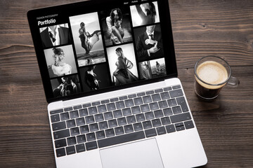 Wall Mural - Artistic black and white photography website on the screen of laptop computer