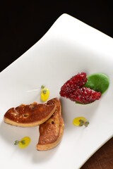 Wall Mural - Fine dining, Roasted foie gras with cherry sauce on the plate