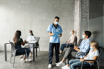 International group of patients waiting for vaccination at clinic